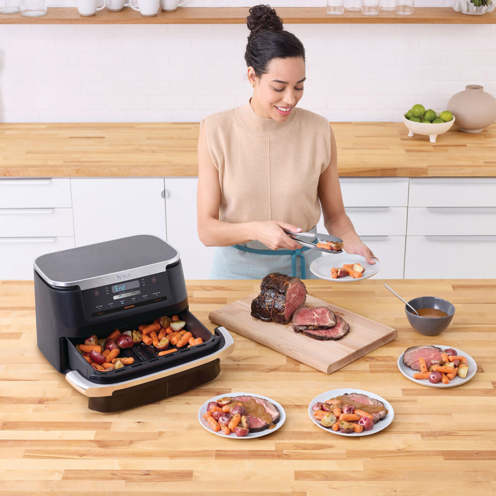Ninja AF550EU InUse Kitchen Island FamilySized Roast Woman